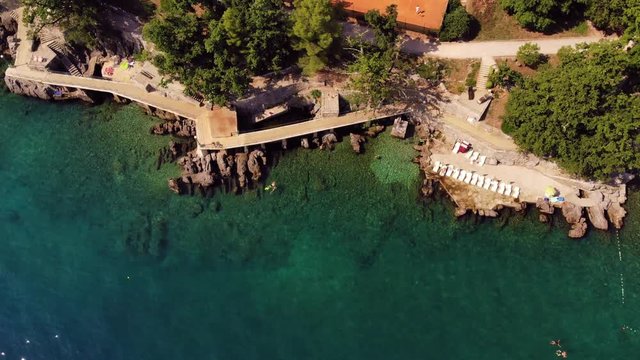 View of the beach and blue sea coast of Lovran, Croatia, August 2019. Top view.
