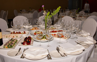 Solemn table with cold appetizers in the restaurant