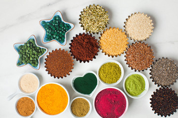 Superfood smoothie boosters, various dietary supplements in bowls