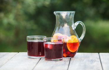 Refreshing sangria or punch with fruits in pincher