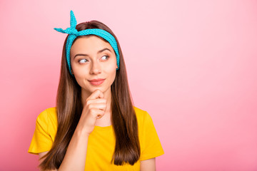 Photo of charming gorgeous broody girl thinking on how to pick that guy up while isolated with vivid background wearing blue headband with pin-up