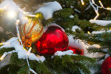 Christmas winter tree New Year's toys lanterns at the festive fair. Holiday background.