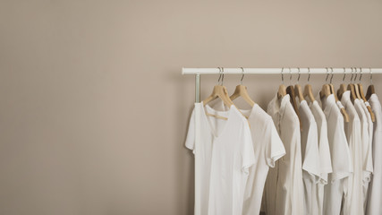 Simple wardrobe with white t-shirts copy space