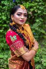 Fototapeta premium Young indian Bride in traditional sari and jewelry. South Indian and Maharashtran bride look. 