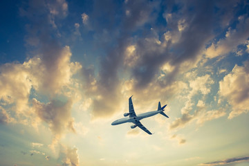 Fototapeta na wymiar Airplane on blue sky and clouds, fly concept