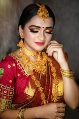 Young indian Bride in traditional sari and jewelry. South Indian and Maharashtran bride look. 