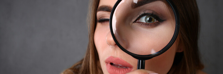 Young beautiful woman portrait looks painful eye lens search on Internet information employer does...