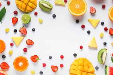 Fotobehang Frame made of ripe fruits and berries on white background © Pixel-Shot