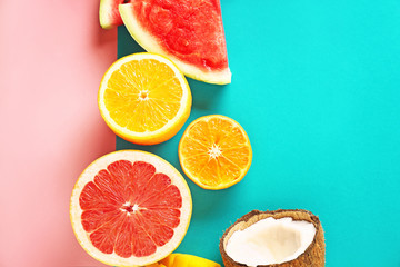 Sweet ripe fruits on color background