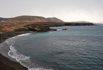 Fototapeta na wymiar Ajuy black beach with rocky coast, Fuerteventura