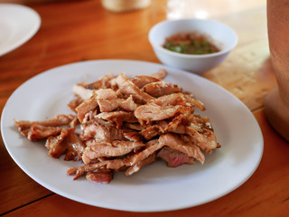 grilled beef medium on plastic dish and spicy dip Thai style