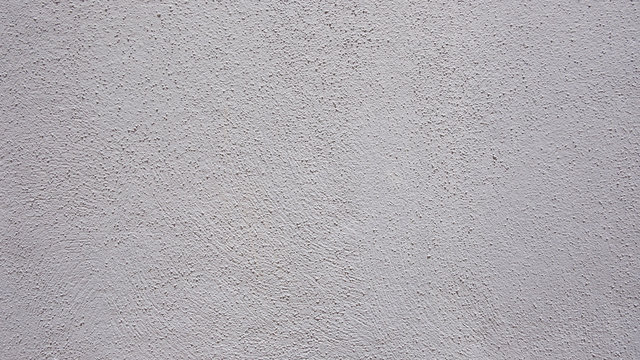 Abstract background of a flat gray wall or ceiling, neutral and neat backdrop with drywall texture and copy space