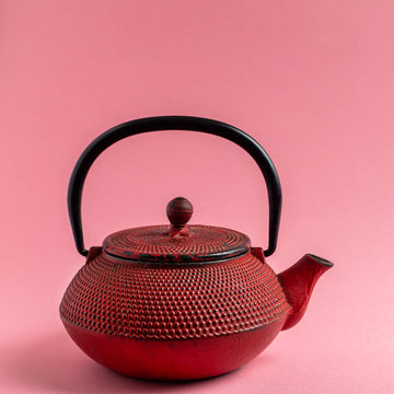 Red cast iron tea pot.