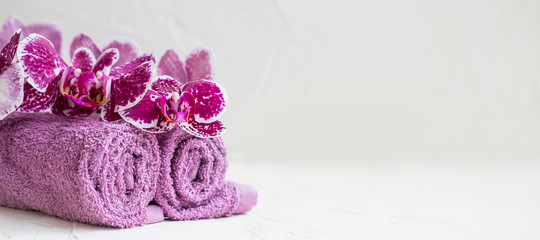 Spa still life with bath towels and orchid flower