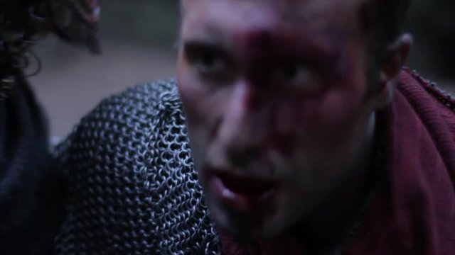 Medieval knight impaled and falls to the ground