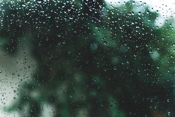 Water drops on glass. wet home windows. autumn cold