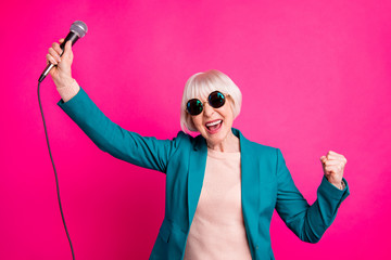 Portrait of her she nice-looking attractive well-dressed cheerful gray-haired lady enjoying free...