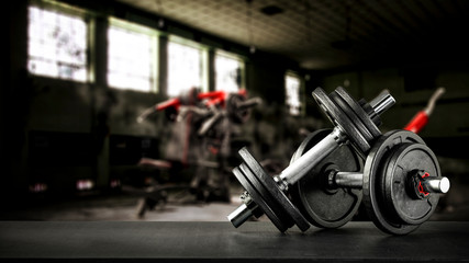 Fototapeta na wymiar Gym interior and dumbbells on black desk with free space for your decoration. 