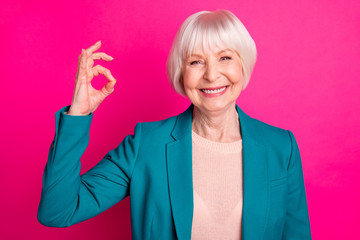 Close-up portrait of nice attractive lovely cheerful cheery content gray-haired lady wearing blue...