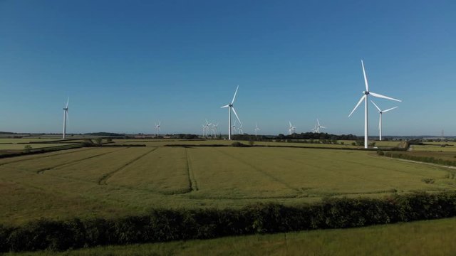 Wind Farm Northamptonshire In Green Crop Fields  Blue Sky Summer Aerial 4K
