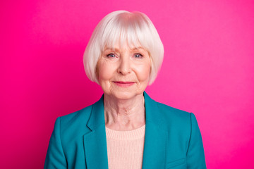 Close-up portrait of her she nice-looking attractive lovely winsome gorgeous peaceful calm gray-haired woman wearing green jacket isolated over bright vivid shine vibrant pink fuchsia color background