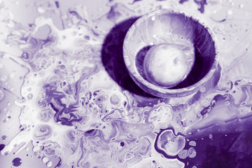 Obraz na płótnie Canvas Decoration with purple paint in a bowl