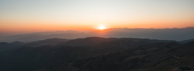 Fototapeta na wymiar Beautiful sunset over Taurus Mountains from the top of Tahtali Mountain near Kemer, Antalya, Turkey