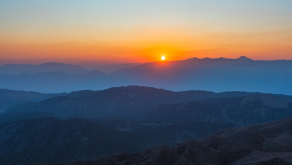 Fototapeta premium Beautiful sunset over Taurus Mountains from the top of Tahtali Mountain near Kemer, Antalya, Turkey