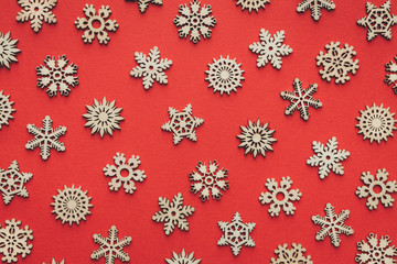 Wooden Snowflakes On Red Background