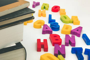 alphabet letters around books