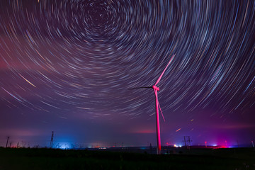 Wind turbines and star trails at night