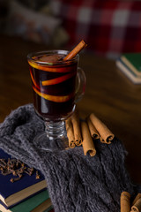 Mulled wine in glass cup with spices.