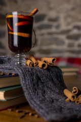 Mulled wine in glass cup with spices.