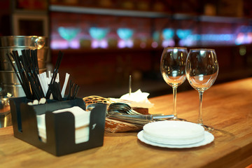 Fototapeta na wymiar Clean wine glasses on table in bar