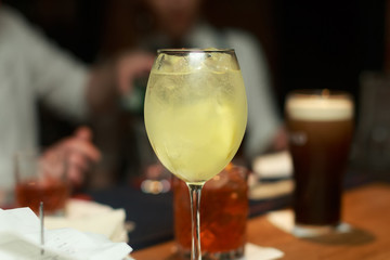 Cocktail with lemon on bar in restaurant