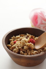 Healthy breakfast, granola in wooden bowlHealthy breakfast, granola in wooden bowl