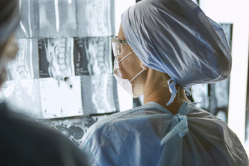 Fototapeta na wymiar Two female women medical doctors looking at x-rays in a hospital