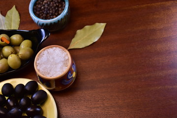 olives and spices on a black background
