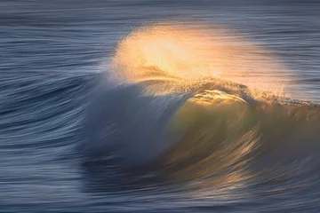 Foto op Canvas smooth wave breaking with panning effect © mimadeo