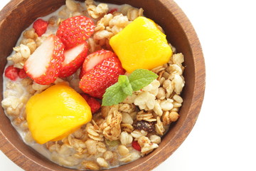 Healthy breakfast, granola mango and strawberry cereal and milk
