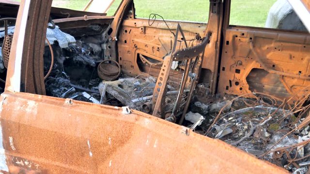 25150_The_rusty_and_broken_parts_of_the_burnt_car.mov