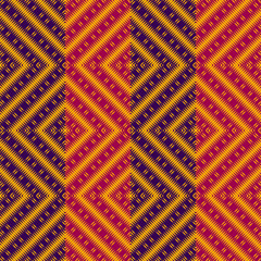 Vector ethnic rhombs texture . Carpet or wallpaper pattern. Red, blue and yellow colors