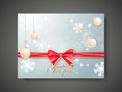 Merry Christmas gift card with red ribbon on snowflake background decorated with hanging baubles.