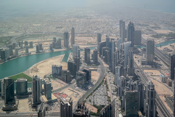 Fototapeta na wymiar Aerial beautiful view of Downtown Dubai, Skyscrapers and landmarks - Dubai mall and the Dubai fountain, a view from Burj Khalifa