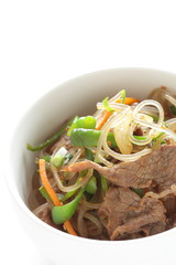 Korean food, glass noodles and beef stir fried with vegetable