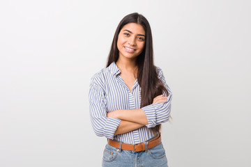 Young pretty arab woman who feels confident, crossing arms with determination.