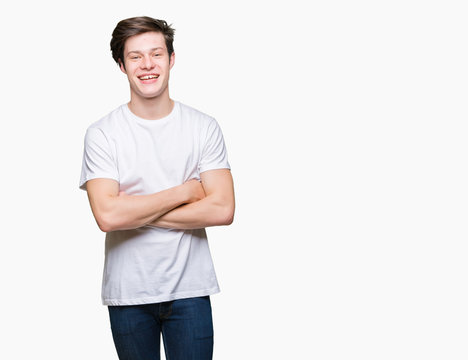 Young handsome man wearing casual white t-shirt over isolated background happy face smiling with crossed arms looking at the camera. Positive person.