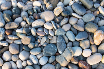 Gray sea pebbles of the Mediterranean Sea. Turkey. Top view, close-up.
