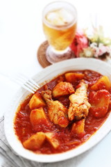 Chicken drumsticks and potato simmered 