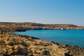 Fototapeta na wymiar Beautiful landscape near of Cavo Greco in Ayia Napa, Cyprus island, Mediterranean Sea. Amazing blue green sea and sunny day. Horizontal